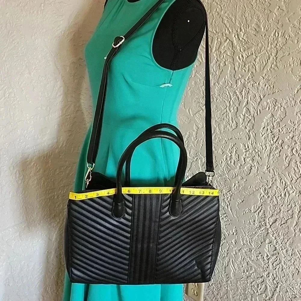 A new day tm.large bag great for laptop 💻 like new use only at few times.